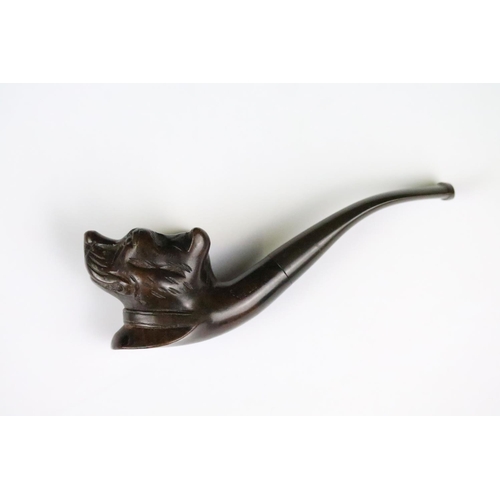 311 - Two novelty wooden smokers pipes with carved bowls in the form of animals.