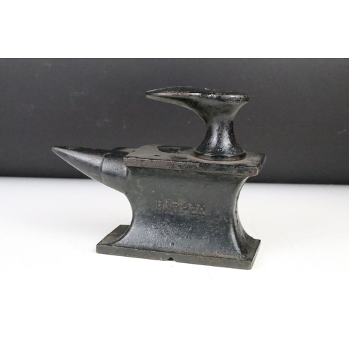 327 - Cast Iron Miniature Cobbler's Anvil by Harper and number 4006 with an attached shoe last, 22cm long