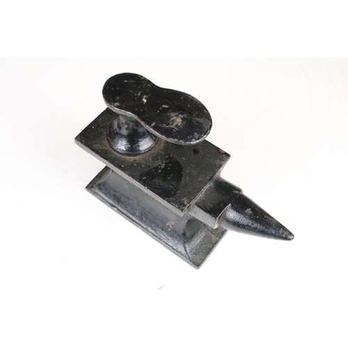 327 - Cast Iron Miniature Cobbler's Anvil by Harper and number 4006 with an attached shoe last, 22cm long