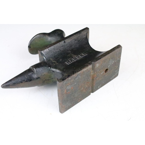 327 - Cast Iron Miniature Cobbler's Anvil by Harper and number 4006 with an attached shoe last, 22cm long