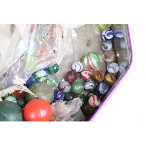 331 - A large collection of mixed marbles of various sizes and colours contained within two tins.