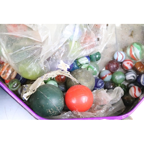 331 - A large collection of mixed marbles of various sizes and colours contained within two tins.