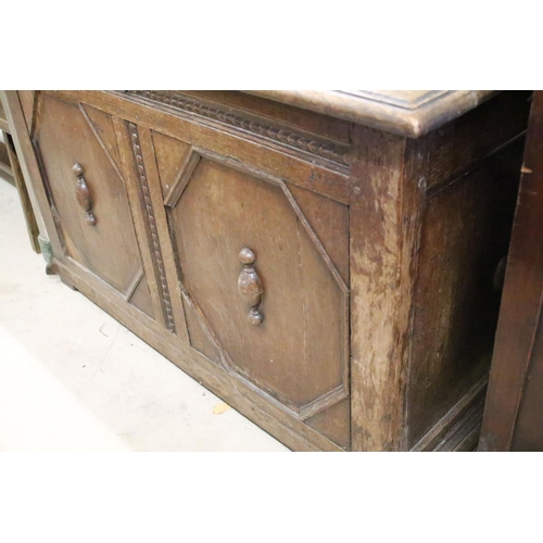 592 - 18th or 19th century Oak Coffer, the two panel front with moulded geometric design, 71cm high x 112c... 