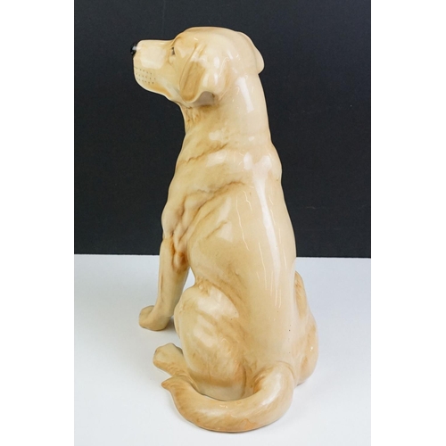 11 - Two large ceramic dogs to include a Beswick German Shepherd and an unmarked Yellow Labrador (a/f). M... 