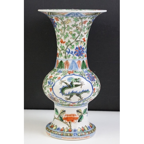 16 - Chinese porcelain gu vase having blue underglaze detailing featuring a dragon with green, red and ye... 