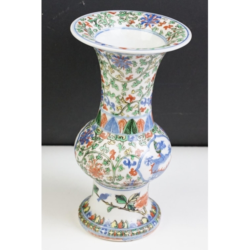 16 - Chinese porcelain gu vase having blue underglaze detailing featuring a dragon with green, red and ye... 