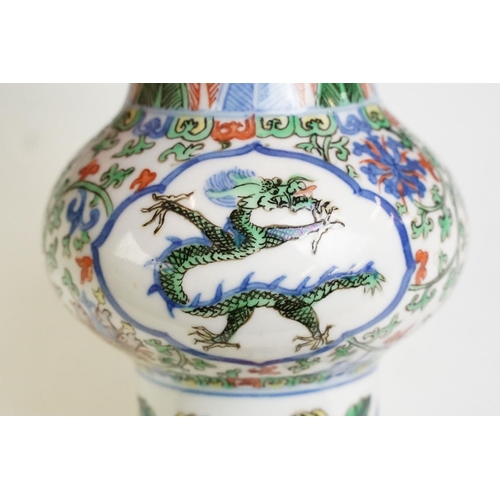 16 - Chinese porcelain gu vase having blue underglaze detailing featuring a dragon with green, red and ye... 