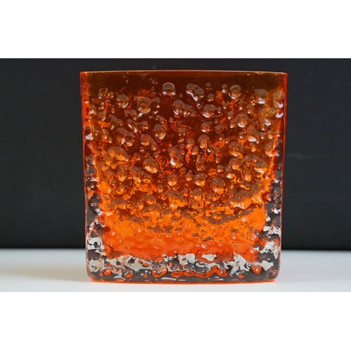 18 - Whitefriars tangerine nail head glass vase of square form. Measures 11.5cm tall.