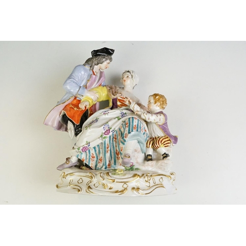 21 - 1920s German Meissen ceramic figurine group featuring a couple and child with hand painted detailing... 