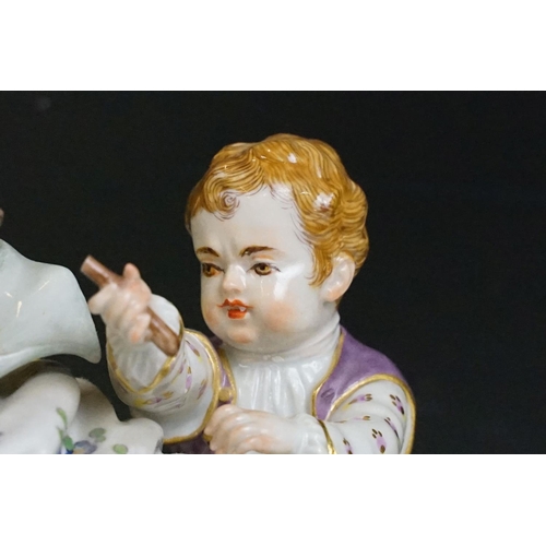 21 - 1920s German Meissen ceramic figurine group featuring a couple and child with hand painted detailing... 