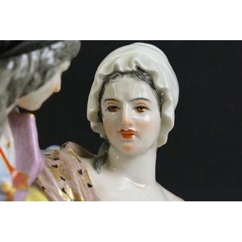 21 - 1920s German Meissen ceramic figurine group featuring a couple and child with hand painted detailing... 