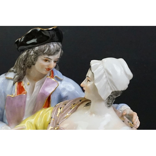 21 - 1920s German Meissen ceramic figurine group featuring a couple and child with hand painted detailing... 