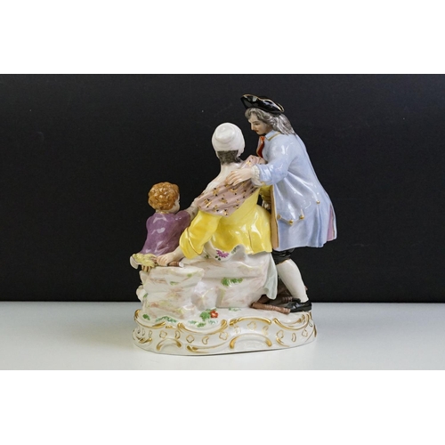 21 - 1920s German Meissen ceramic figurine group featuring a couple and child with hand painted detailing... 