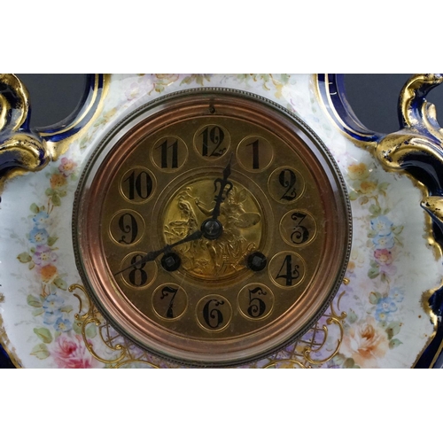 23 - Ceramic mantle clock having moulded scrolled acanthus leaf detailing with floral detailing, and roun... 