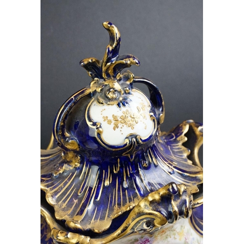 23 - Ceramic mantle clock having moulded scrolled acanthus leaf detailing with floral detailing, and roun... 