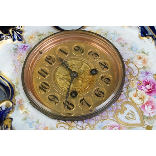 23 - Ceramic mantle clock having moulded scrolled acanthus leaf detailing with floral detailing, and roun... 