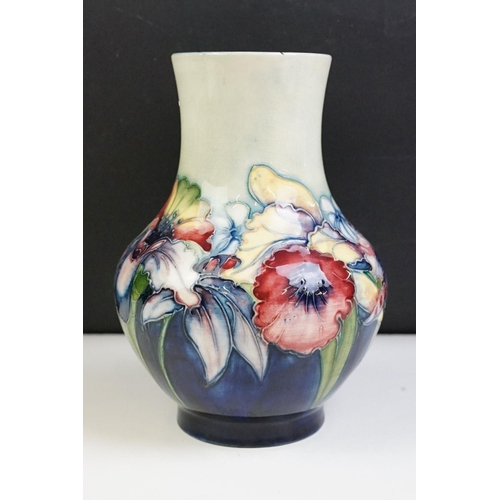 24 - Moorcroft Orchid pattern small baluster vase with tube lined detailing. Impressed Moorcroft mark to ... 