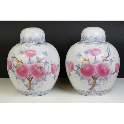 26 - Pair of Chinese large ginger jars, each having printed pink and blue floral designs. Blue seal marks... 