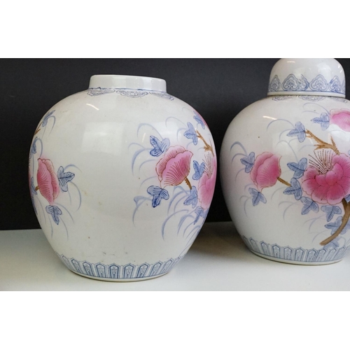 26 - Pair of Chinese large ginger jars, each having printed pink and blue floral designs. Blue seal marks... 