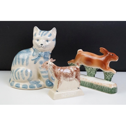 44 - Three Rye pottery ceramic animals to include a blue and white cat, hare and goat. All with stamped m... 