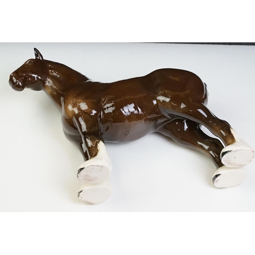 51 - Two Beswick horses to include a white footed shire horse together with a black and white appaloosa s... 