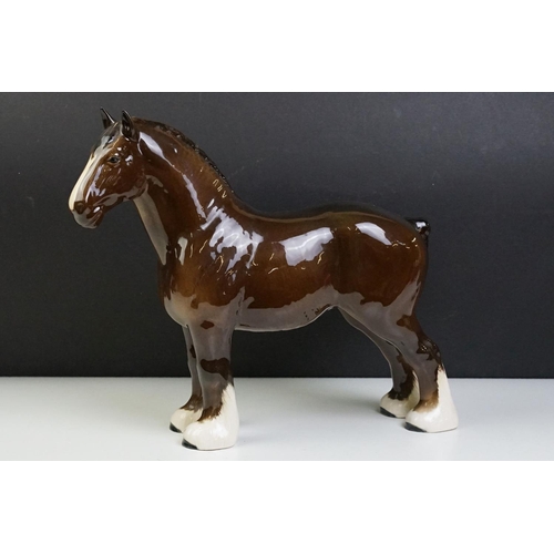 51 - Two Beswick horses to include a white footed shire horse together with a black and white appaloosa s... 