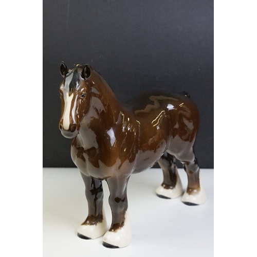 51 - Two Beswick horses to include a white footed shire horse together with a black and white appaloosa s... 