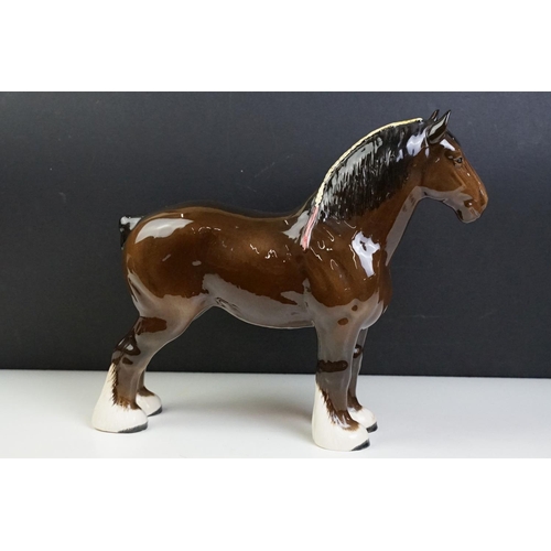 51 - Two Beswick horses to include a white footed shire horse together with a black and white appaloosa s... 