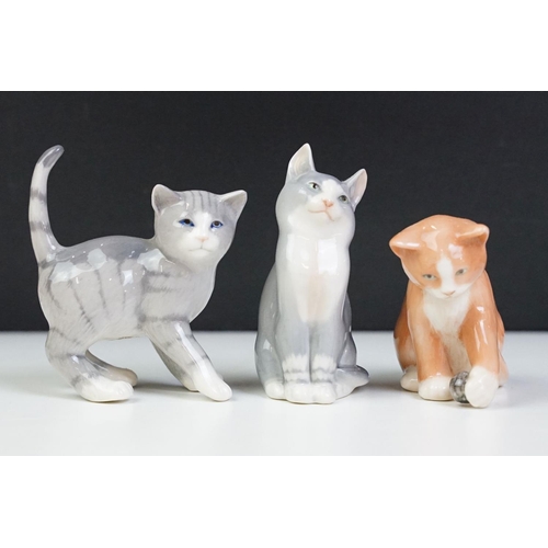 53 - Group of Royal Copenhagen mini collection cats including single and group figures, 12 in total. Gilt... 