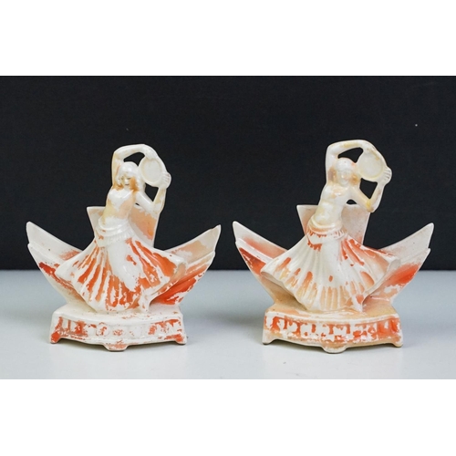 57 - Pair of Art Deco ceramic mirror stands in the form of belly dancers, each holding a round bevelled g... 