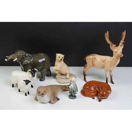 59 - Collection of mostly Beswick ceramic animals to include an elephant, fox, stag, horned sheep as well... 