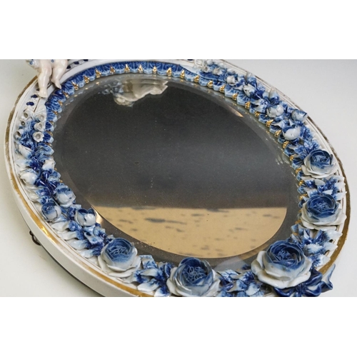 67 - Sitzendorf porcelain dressing table mirror with blue & white floral encrusting, putti with garland t... 