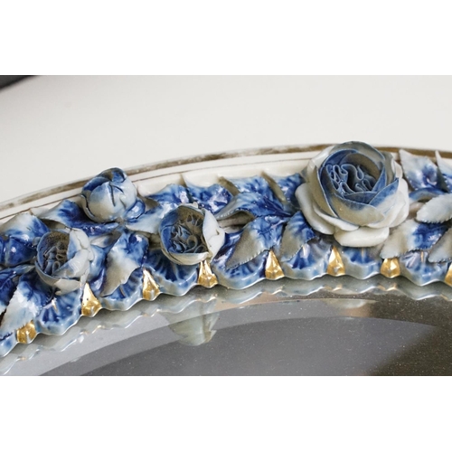 67 - Sitzendorf porcelain dressing table mirror with blue & white floral encrusting, putti with garland t... 