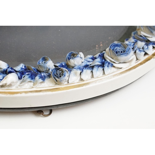 67 - Sitzendorf porcelain dressing table mirror with blue & white floral encrusting, putti with garland t... 