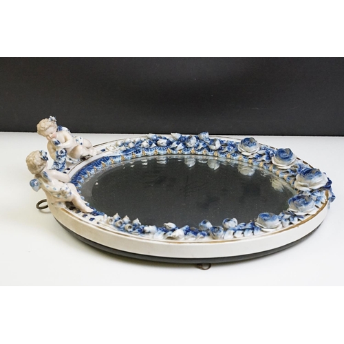 67 - Sitzendorf porcelain dressing table mirror with blue & white floral encrusting, putti with garland t... 