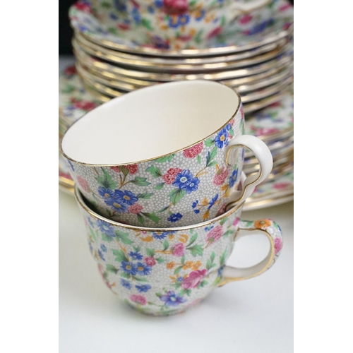 68 - Royal Winton / Grimwades ' Old Cottage Chintz ' pattern tea set, to include teapot, water jug, 12 te... 