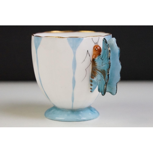 6A - Aynsley Art Deco tea cup and saucer having a butterfly formed handle, gilt rims and blue hand painte... 