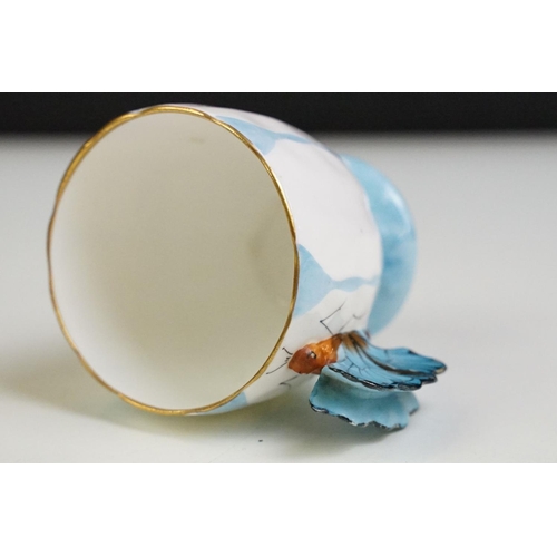 6A - Aynsley Art Deco tea cup and saucer having a butterfly formed handle, gilt rims and blue hand painte... 