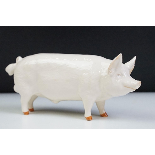 74 - Seven Beswick porcelain animal figures to include a Hereford 'Champion of Champions' Bull, 2 x Pigs ... 