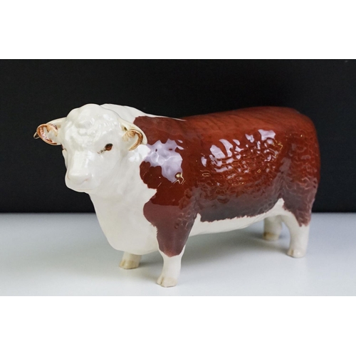 74 - Seven Beswick porcelain animal figures to include a Hereford 'Champion of Champions' Bull, 2 x Pigs ... 