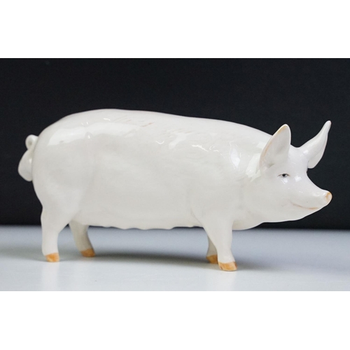 74 - Seven Beswick porcelain animal figures to include a Hereford 'Champion of Champions' Bull, 2 x Pigs ... 