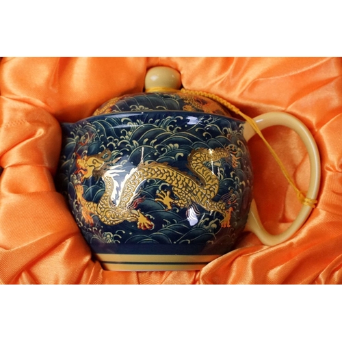 94 - 20th Century Japanese tea set with enamel dragon decoration, comprising teapot, milk jug & 6 tea bow... 