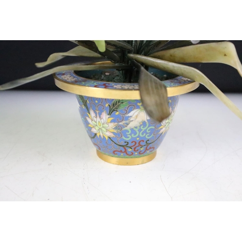 160 - Chinese Hardstone Flower held in a Cloisonne Bowl decorated with flowers on a blue ground, 43cm high