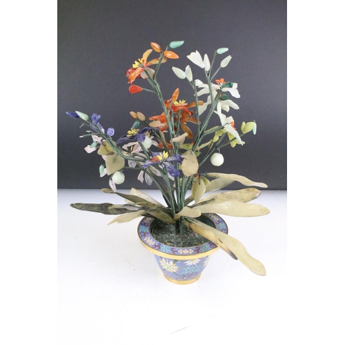 160 - Chinese Hardstone Flower held in a Cloisonne Bowl decorated with flowers on a blue ground, 43cm high