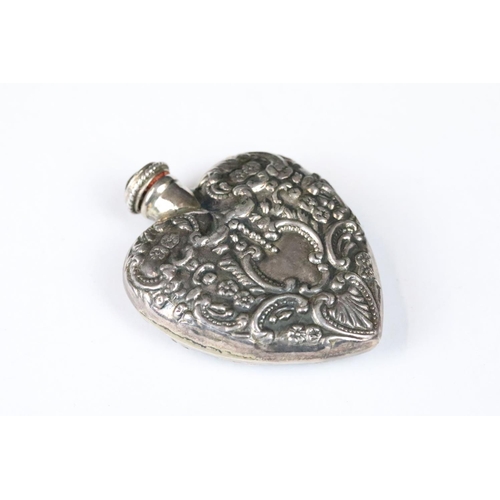 260 - A fully hallmarked sterling silver heart shaped scent bottle with Repoussé decoration, hallmarked to... 