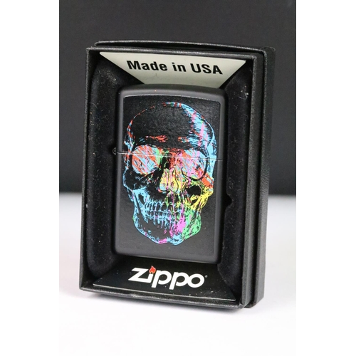 278 - A collection of six boxed Zippo lighters to include Texas Twister, Skull, USA Flag, Vintage Brass, P... 