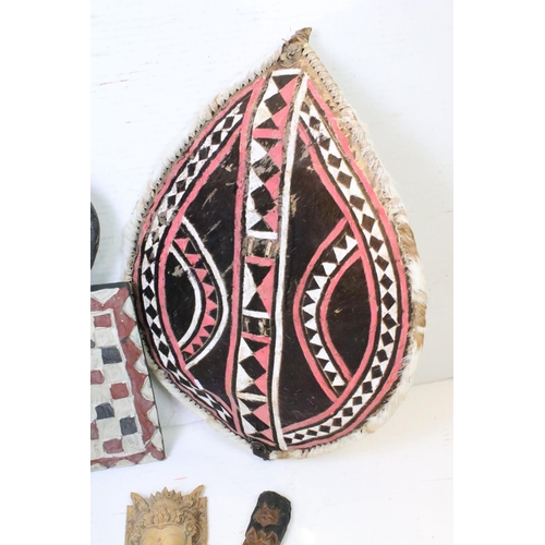 366 - Ethnographica - East African Maasai tribal hide shield (approx 81cm tall), together with an Ivory Co... 