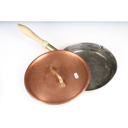 374 - Two copper cooking pans, with covers & turned wooden handles. Largest approx 48cm long (including ha... 