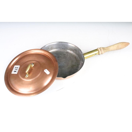 374 - Two copper cooking pans, with covers & turned wooden handles. Largest approx 48cm long (including ha... 