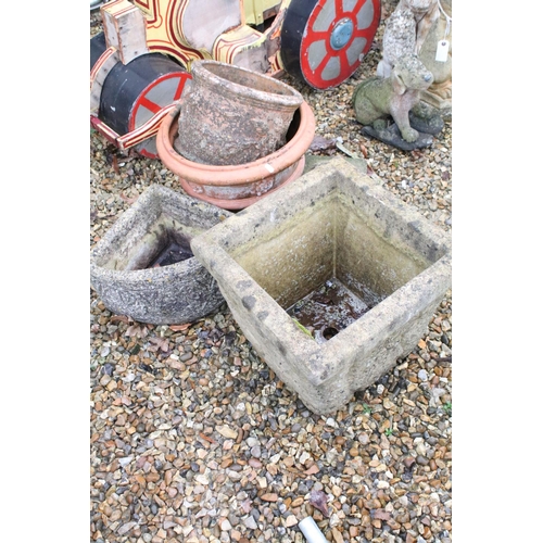 533 - Two reconstituted stone planters (largest approx 37cm high), together with two terracotta examples